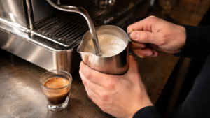 Steaming milk with minimal aeration for a cortado